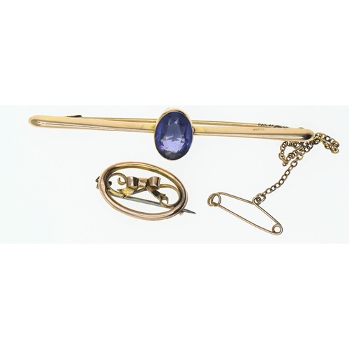 155 - 15ct gold bar brooch set with a purple paste stone, gross weight 3.43g, together with a small 9ct go... 