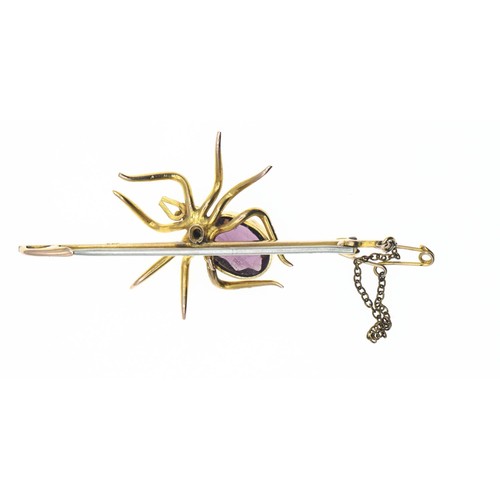 156 - 9ct gold mounted spider bar brooch. Body set with a purple paste stone and seed pearl. Gross weight ... 