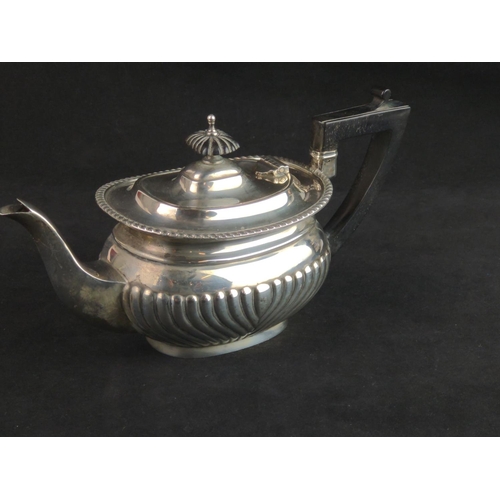 344 - George V silver teapot, Jenkins & Timms, Sheffield 1922, with half reeded lower body, eboni... 