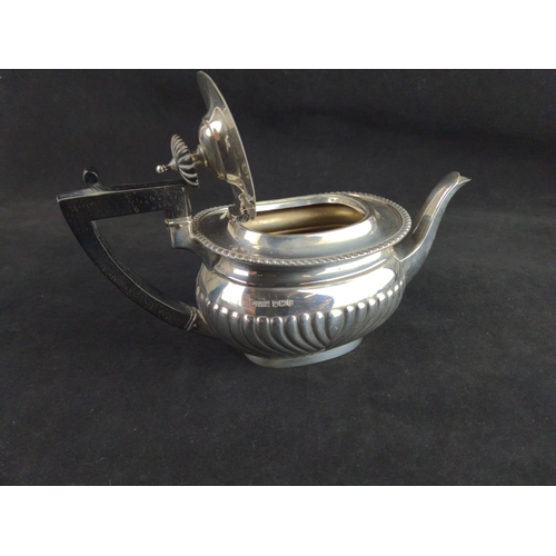 344 - George V silver teapot, Jenkins & Timms, Sheffield 1922, with half reeded lower body, eboni... 