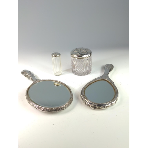 390 - Silver mounted hand mirror and two silver topped glass vanity jars with embossed Reynold's angels, t... 