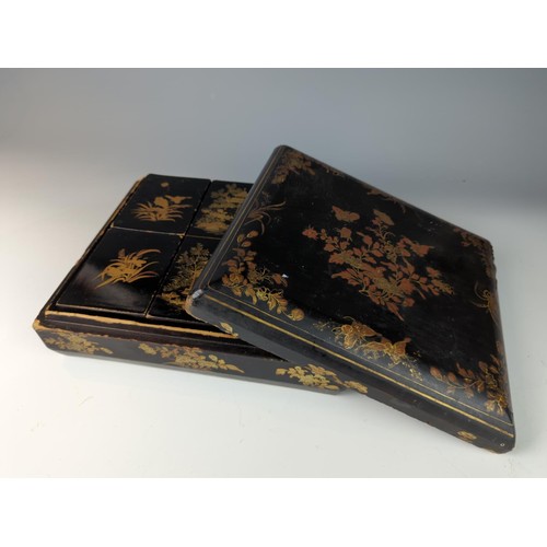 410 - Black and Gilt lacquered oriental box with 6 internal fitted boxes W29 D26 H9cm