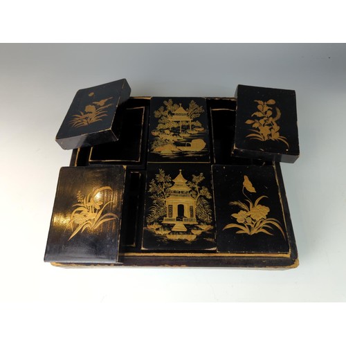 410 - Black and Gilt lacquered oriental box with 6 internal fitted boxes W29 D26 H9cm