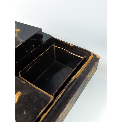 410 - Black and Gilt lacquered oriental box with 6 internal fitted boxes W29 D26 H9cm