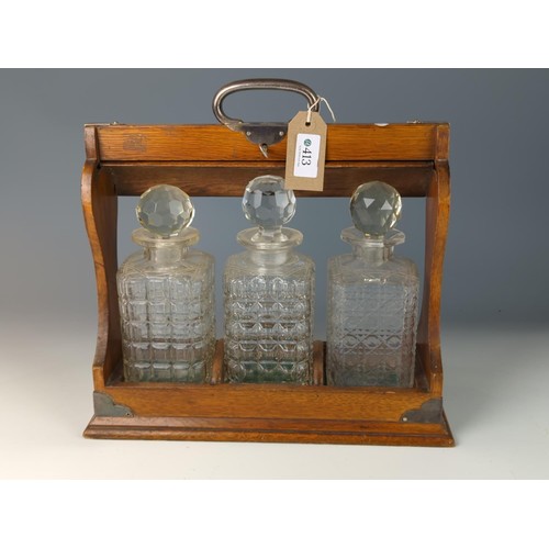 413 - 3 decanter tantalus with key, decanters are replacements W35 D14 H34cm