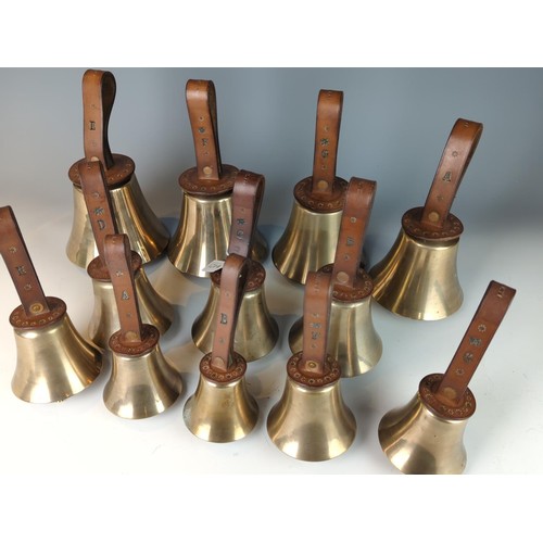 421 - Set of twelve brass leather handled campanology hand bells, leather handles stamped F.R. Barnett and... 