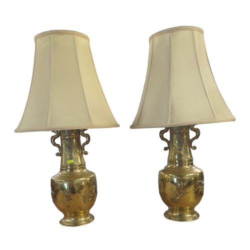 419 - Pair of Japanese brass urn lamps with fitted lampshades and flora and fauna decorations H77cms