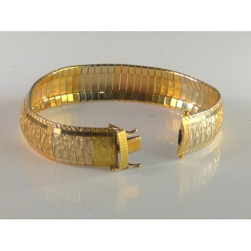 89 - 18ct gold tri- colour omega style bracelet. Gross weight 38.80g.