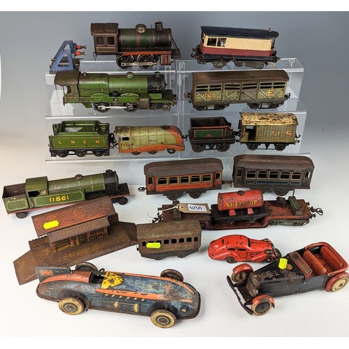 423A - O gauge trains and clock work cars, including 4 Engines, 3 cars inc The Bluebird, rolling stock and ... 