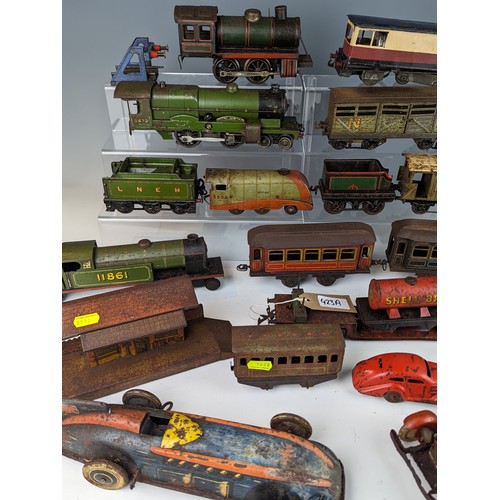 423A - O gauge trains and clock work cars, including 4 Engines, 3 cars inc The Bluebird, rolling stock and ... 