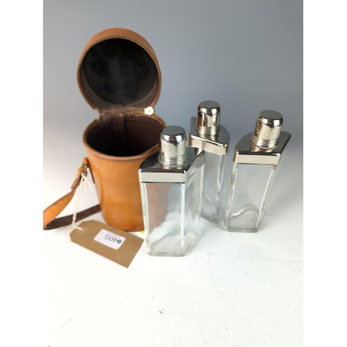 405 - 3 Piece triangular lead glass shooting flasks in purpose made leather case D10.5 H18.5cm