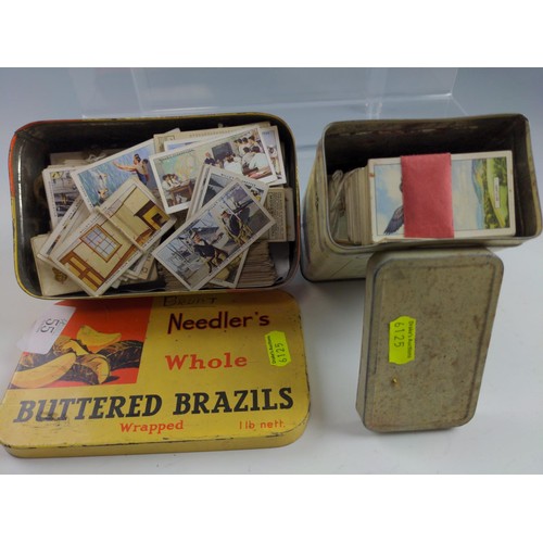 55 - Vintage tins with cigarette card contents and Carrera slip in cigarette card album.