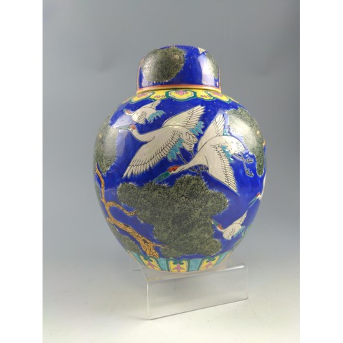 64 - Modern Chinese ginger jar with cover, decorated with cranes on a blue background  27cm