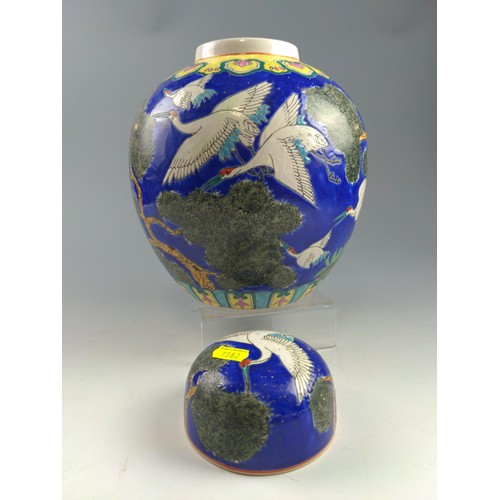 64 - Modern Chinese ginger jar with cover, decorated with cranes on a blue background  27cm