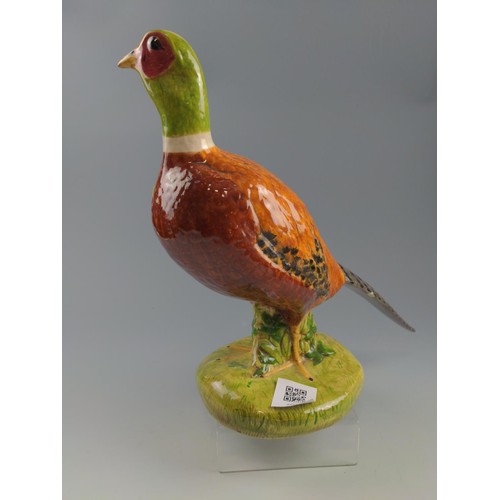 69 - Male and female ceramic pheasants both signed Audrey 1978. Tallest 31cm