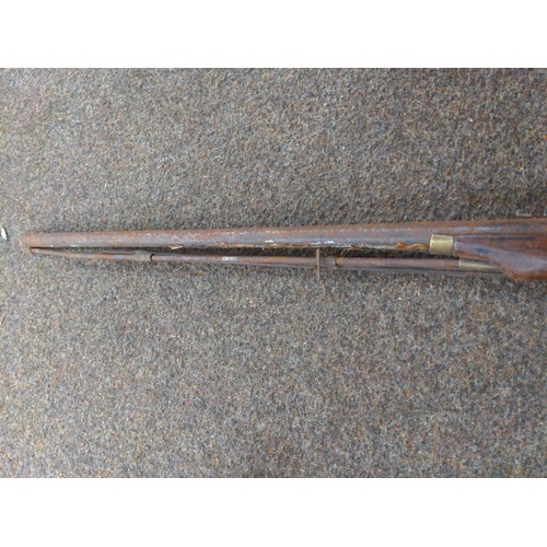 31 - Antique flintlock rifle in as found condition. Length 123cm