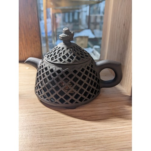 342 - Three Chinese tea pots. One includes tray and cups.