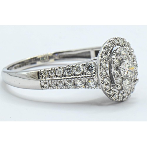 226 - 18ct white gold and diamond oval cluster ring, size R, gross weight 3.9 grams
