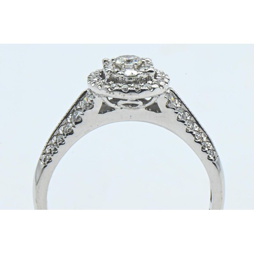 226 - 18ct white gold and diamond oval cluster ring, size R, gross weight 3.9 grams