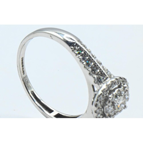 226 - 18ct white gold and diamond oval cluster ring, size R, gross weight 3.9 grams