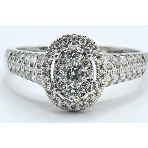 226 - 18ct white gold and diamond oval cluster ring, size R, gross weight 3.9 grams