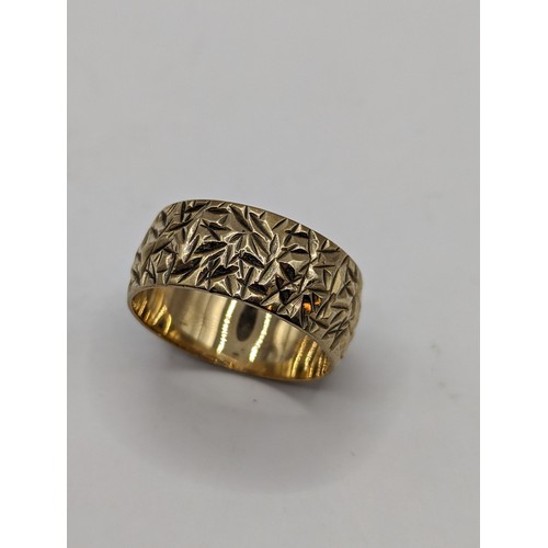 236 - 9ct gold band with textured finish, size J, 2.79 grams