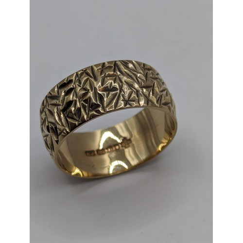 236 - 9ct gold band with textured finish, size J, 2.79 grams