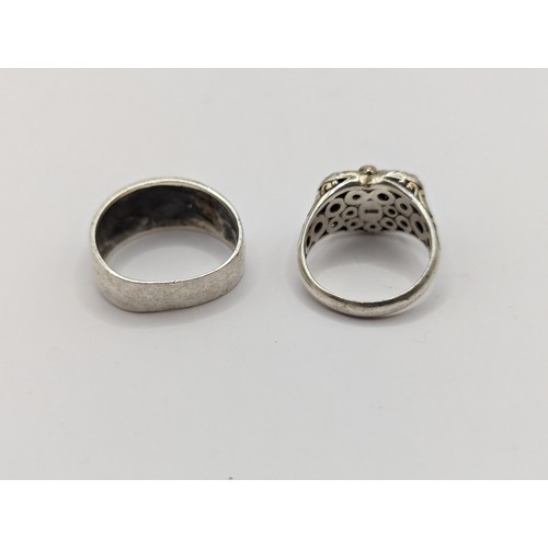 244 - Four pieces of 925 silver jewellery, including two neck chains and two rings (size S & W respect... 