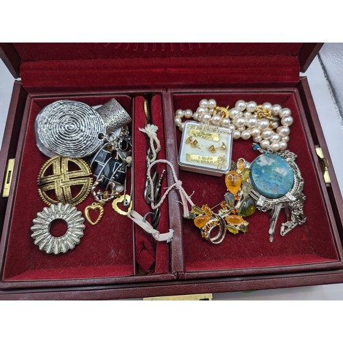 258 - Burgundy coloured jewellery box and contents
