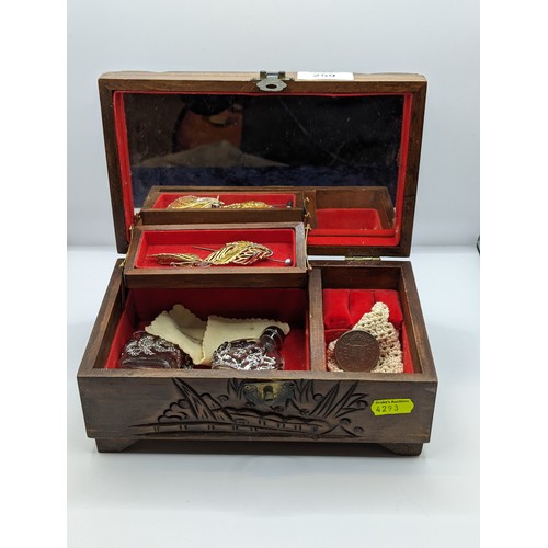 259 - Chinese carved wood jewellery box and contents