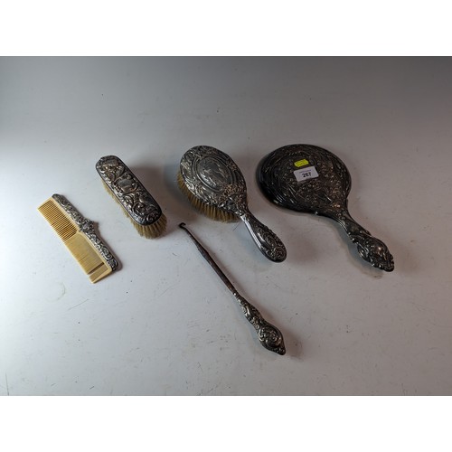 267 - Four assorted silver mounted dressing table items, various makers and dates, and a white metal mount... 