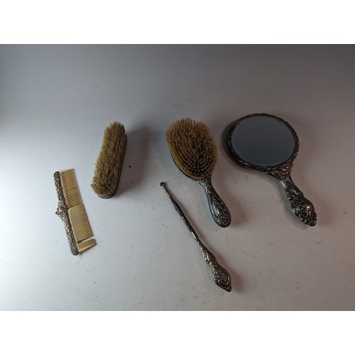 267 - Four assorted silver mounted dressing table items, various makers and dates, and a white metal mount... 