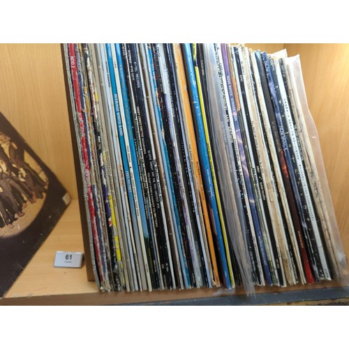 63 - Approximately 59 vinyl albums including The Beatles, Sgt. Peppers & Help.