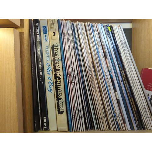 64 - Approximately 50 vinyl albums including Status Quo & Elton John