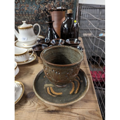 356 - Muchelney stoneware jug together with a tapped flagon, 6 goblets, planter and tray.