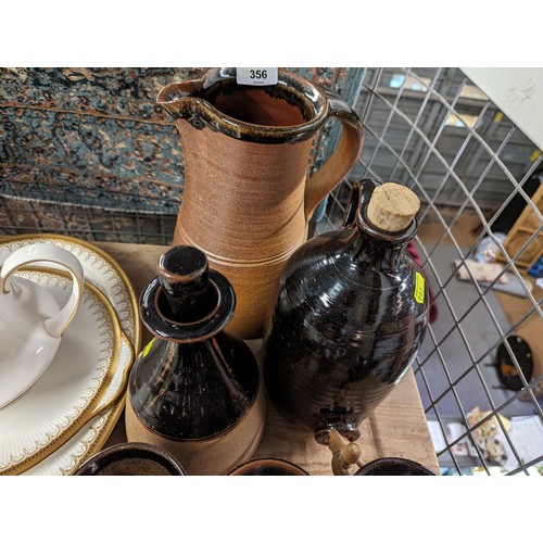 356 - Muchelney stoneware jug together with a tapped flagon, 6 goblets, planter and tray.