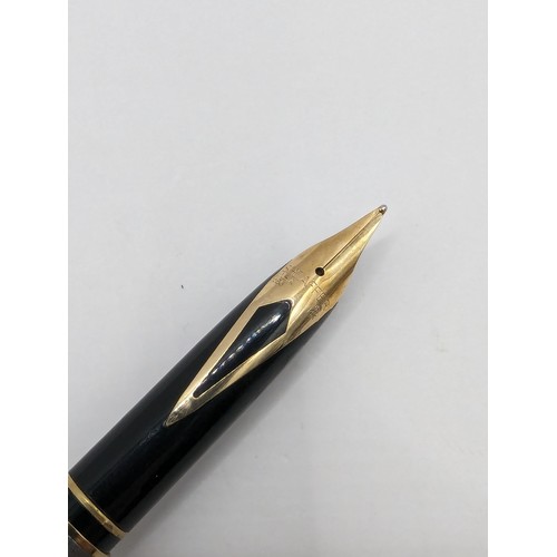 273 - Sheaffer fountain pen with 14ct gold nib, section numbered 72367, length 13.5cm, together with a car... 
