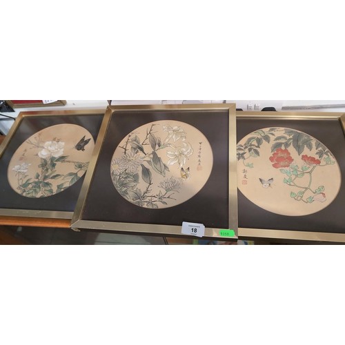 18 - Three framed Oriental paintings on silk of flora and fauna. 32 x 32 cm each