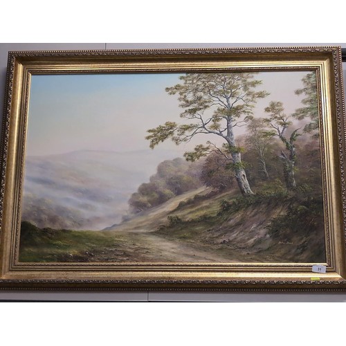 31 - Arthur Read - Oil on canvas of a landscape in a gilt frame. 105cm x 78cm.