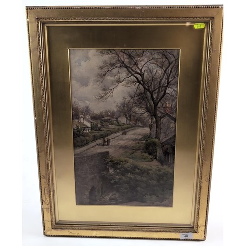 40 - Watercolour painting of a village scene, signed Trobridge, dated 04 in gilt mount and frame. 49cm x ... 