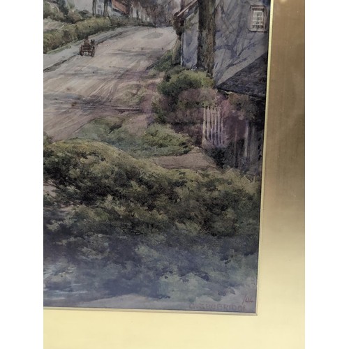 40 - Watercolour painting of a village scene, signed Trobridge, dated 04 in gilt mount and frame. 49cm x ... 