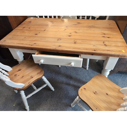 500 - Pine kitchen table with 4 chairs 81cm by 135cm by 77cm