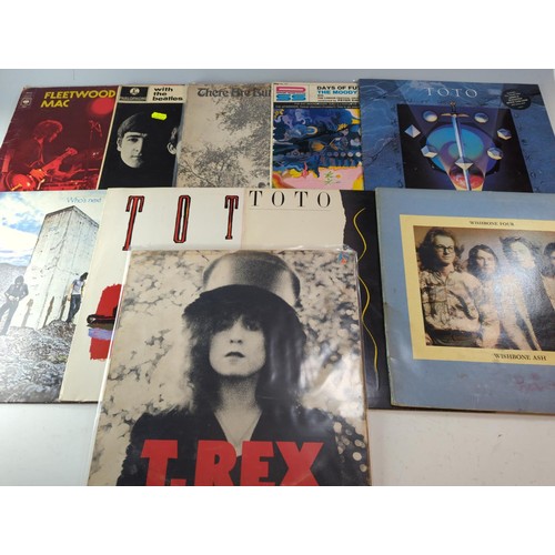 69 - 12 vinyl LPs inc. With The Beatles, Fleetwood Mac & Toto40