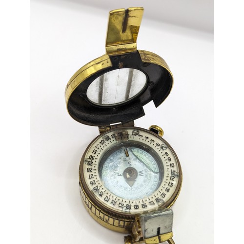 294 - A TG Co. Ltd brass MKIII marching compass no.293222 stamped with broad arrow and 1944
