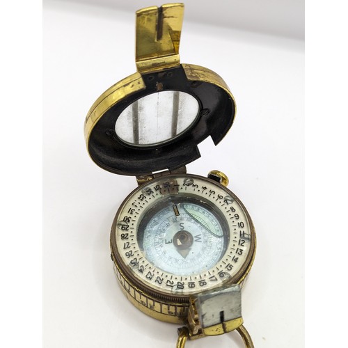 294 - A TG Co. Ltd brass MKIII marching compass no.293222 stamped with broad arrow and 1944