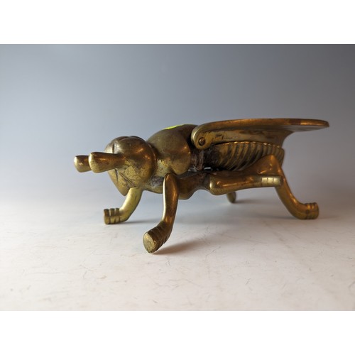 340 - Large brass cicada box with hinged wings. L21cm x H 9cm