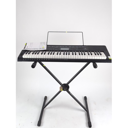 147A - Casio CTK-3500 touch sensitive keyboard with music stand, instructions and keyboard stand