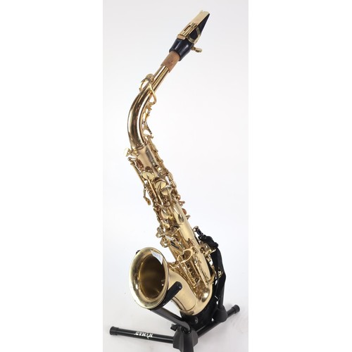 147B - Saxaphone with hard case, stand and music stand. Model number 14080451