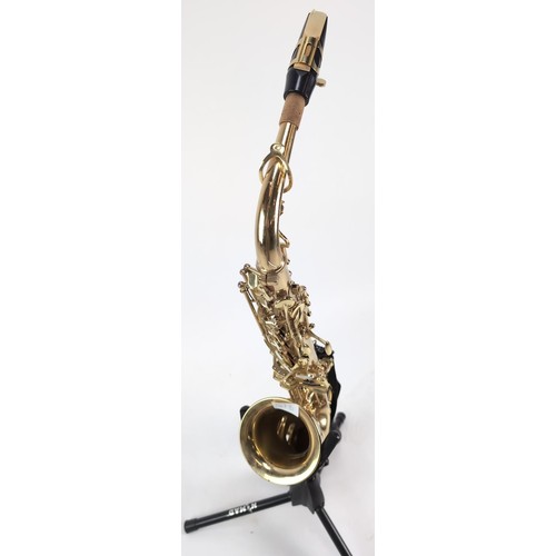 147B - Saxaphone with hard case, stand and music stand. Model number 14080451