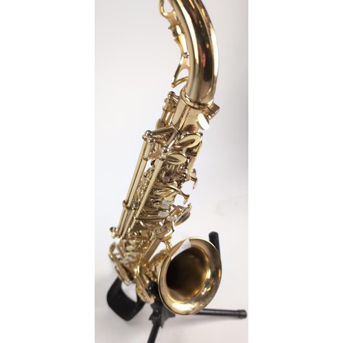 147B - Saxaphone with hard case, stand and music stand. Model number 14080451